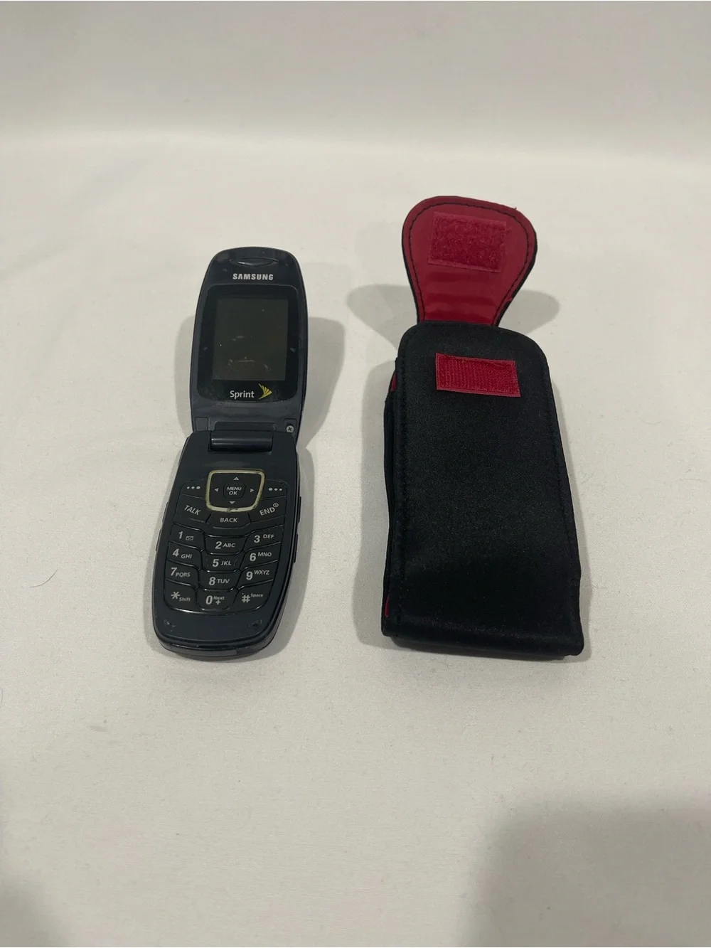 Samsung Black Flip Phone with Black Holster